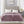 Beautyrest purple heated electric blanket with dual controllers on a bed