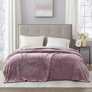 Beautyrest purple heated electric blanket with dual controllers on a bed