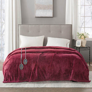 Beautyrest burgundy heated electric blanket with dual controllers on a bed