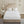 Beautyrest white quilted mattress pad on a bed with a beige tufted headboard