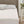 Beautyrest white quilted mattress pad on a bed with pillows and headboard