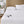 Beautyrest heated mattress pad with two handheld controllers on a white bed