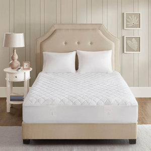 Beautyrest white quilted mattress pad on a bed with two pillows