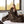 Person wrapped in a brown Beautyrest heated throw blanket on a bed