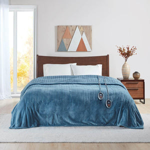 Beautyrest blue heated electric blanket with dual controllers on a bed