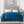 Teal plush electric heated blanket with dual controllers draped over a bed