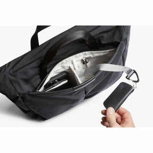 Bellroy bag interior showing internal pockets and a key clip with a leather key fob