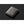 Closed Bellroy leather wallet on a dark background
