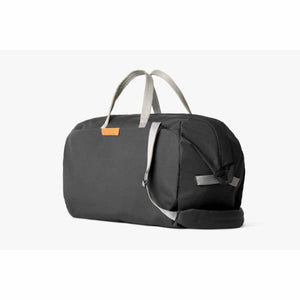 Bellroy black duffel bag with grey handles and shoulder strap