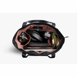 Top view of open Bellroy tote bag filled with laptop headphones water bottle and accessories