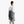 Person wearing a grey Bellroy tote bag over their shoulder