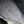 Water droplets on grey diamond pattern fabric of a Bellroy bag