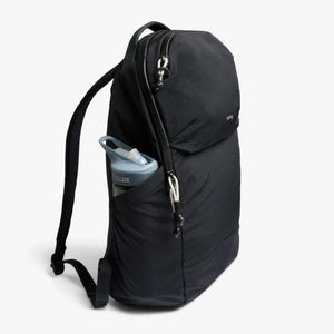 Bellroy black backpack with a CamelBak water bottle in the side pocket