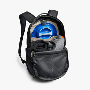 Open Bellroy backpack showing internal hydration bladder and packed gear