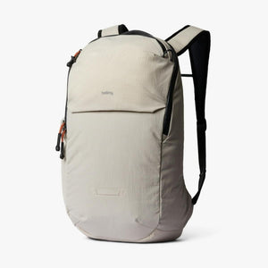 Bellroy beige backpack with black straps and orange zipper pulls