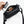 Hand holding a Bellroy key cover over an open black crossbody bag containing small personal items