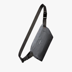 Bellroy grey grid pattern sling bag with black adjustable strap