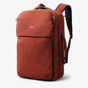 Bellroy rust colored backpack with side handle and shoulder straps