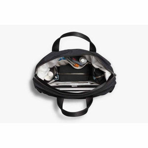 Top view of an open Bellroy bag showing organized interior compartments with a laptop and accessories