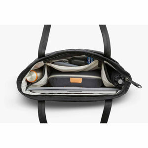 Top view of open Bellroy tote bag filled with laptop, pouch, water bottle, and umbrella