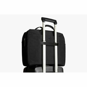 Black Bellroy briefcase attached to luggage handle