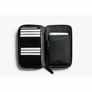 Open black Bellroy travel wallet with card slots and passport holder