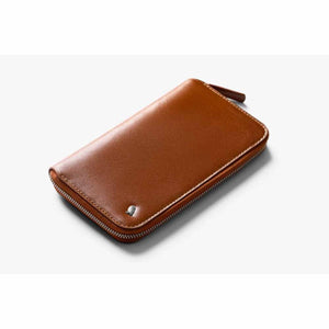 Bellroy tan leather zip wallet with silver owl logo