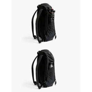 Bellroy black backpack showing side pocket with tripod and water bottle