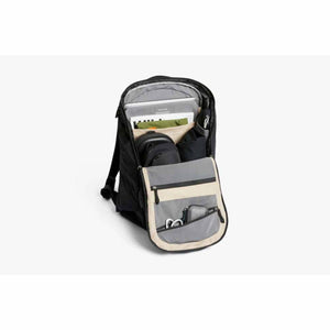 Open Bellroy backpack showing internal organization pockets with laptop and accessories