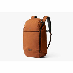 Bellroy copper colored backpack with black zippers and shoulder straps