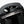 Black Bellroy backpack with sunglasses stored in the top zippered pocket