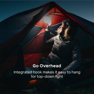 Person hanging a BioLite lantern from the ceiling of a tent