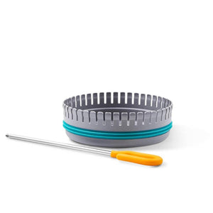 BioLite grey circular grill accessory with teal ring and metal skewer with orange handle