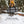 Person carrying a grey BioLite canvas bag for FirePit plus and wood in a snowy forest