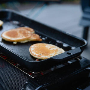 Pancakes cooking on a BioLite cast iron griddle