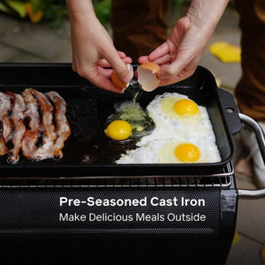 Hands cracking an egg onto a BioLite pre-seasoned cast iron griddle with bacon and eggs cooking