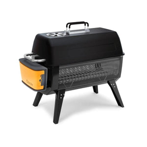 BioLite portable charcoal grill with black lid and orange power pack