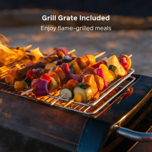 Vegetable skewers cooking on a BioLite grill grate over an open flame