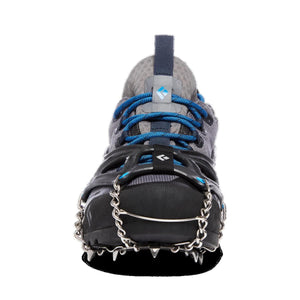 Black Diamond traction device attached to a grey and blue trail running shoe