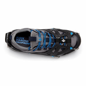Black Diamond traction device attached to a grey and blue hiking shoe