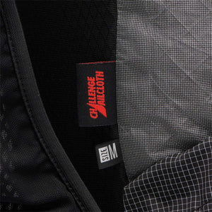 Black Diamond garment interior showing Challenge Sailcloth label and size M tag
