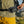 Black Diamond waist pack worn over olive green shirt and yellow shorts