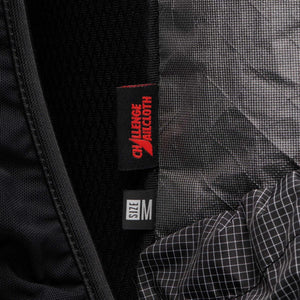 Black Diamond backpack interior showing Challenge Sailcloth fabric label and size M tag