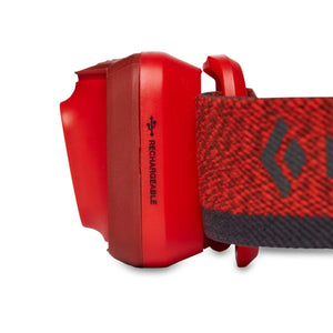 Side view of red Black Diamond rechargeable headlamp housing and strap
