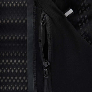 Black Diamond running vest zipper detail showing mesh fabric and reflective trim