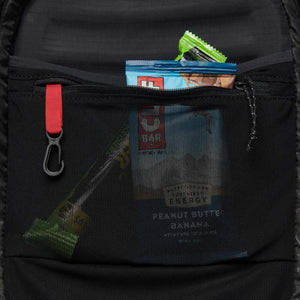 Black Diamond backpack interior mesh pocket containing energy bars and a key clip