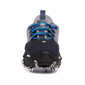 Black Diamond traction device attached to a grey and blue running shoe
