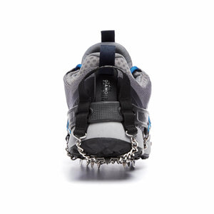 Black Diamond traction device attached to the heel of a grey trail running shoe