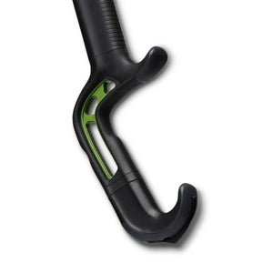 Black and green ergonomic handle of a mobility aid
