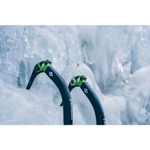 Two Black Diamond ice axes embedded in a frozen ice wall